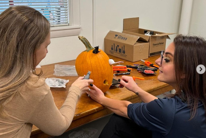 Pathobiology carving their pumpkin